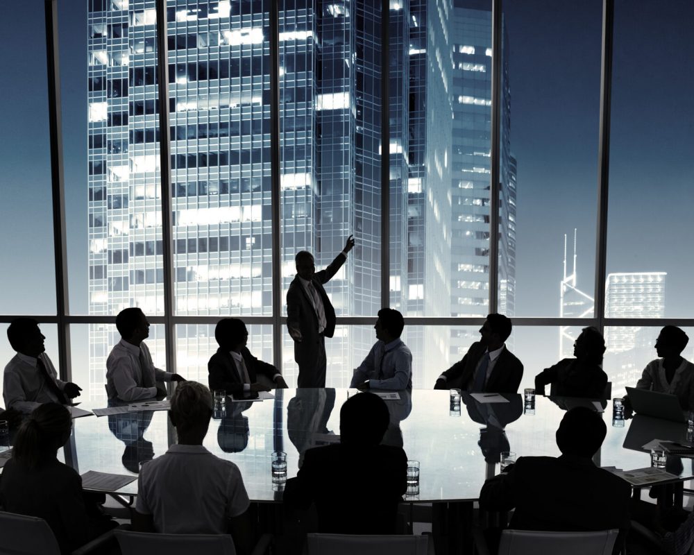 Business people in a board room meeting